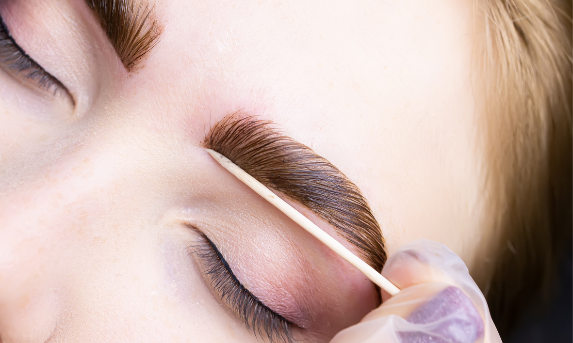 A client with perfectly shaped and laminated eyebrows at FIT Beauty Brisbane.