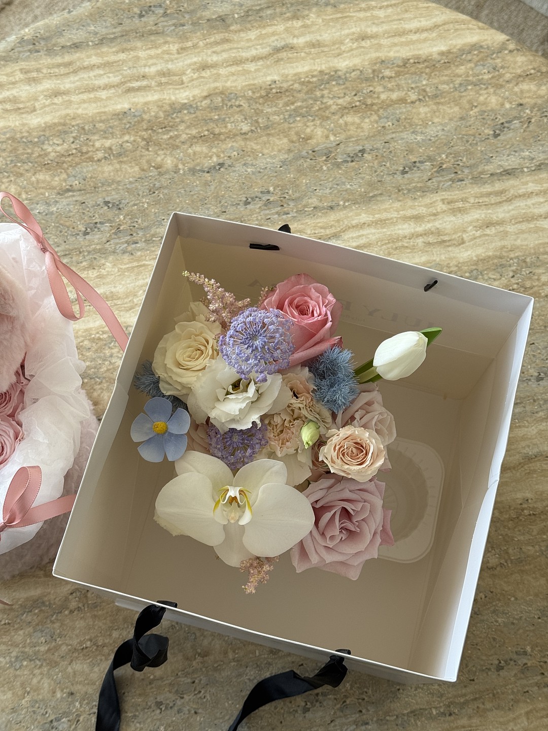 Fresh Mixed Flowers in the Milk Tea Cup