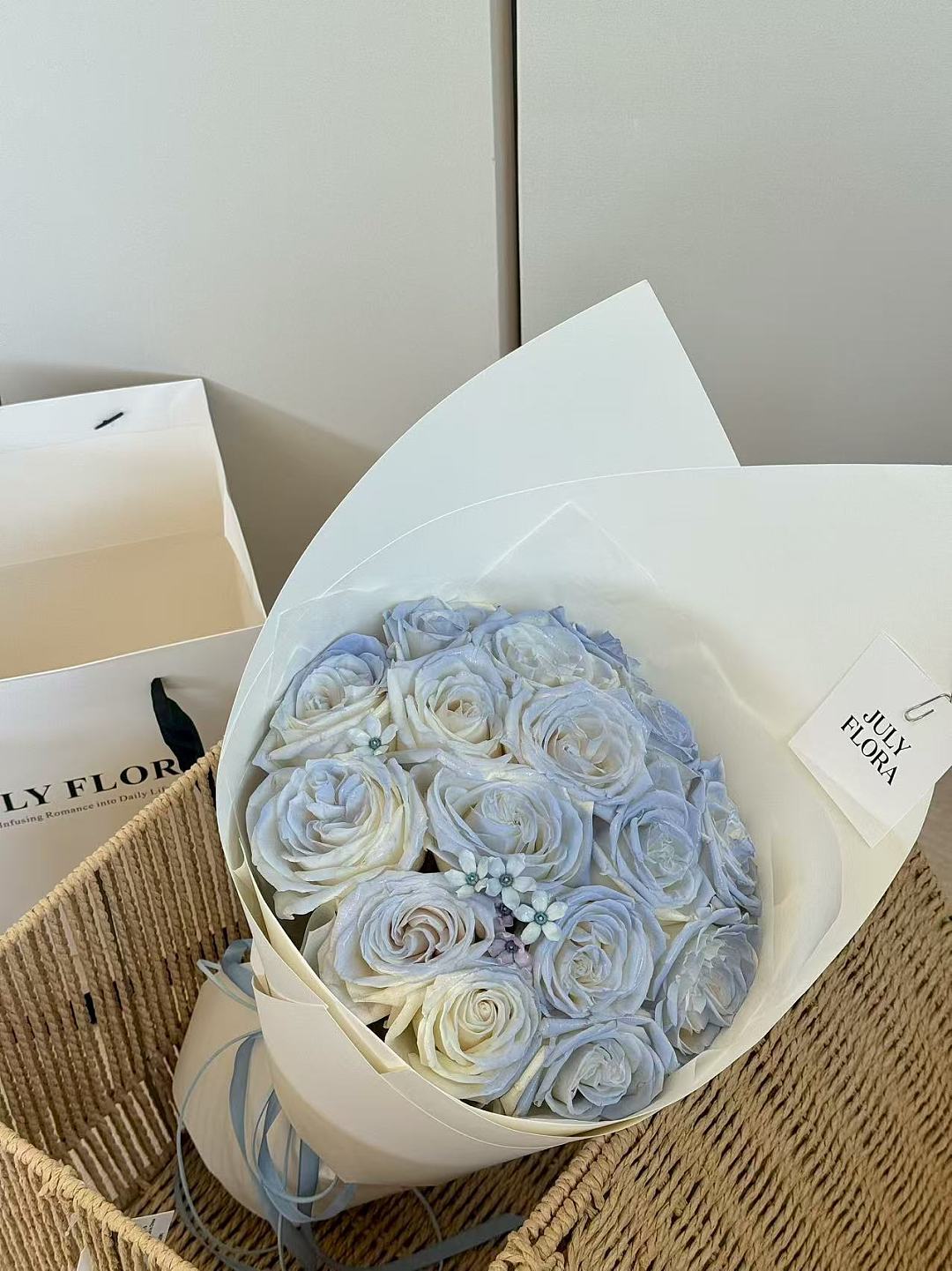 16 Light Blue Roses with Blue Tweedia